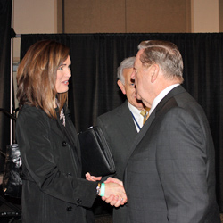 Elder Holland visits with Ally Isom from the Church of Jesus Christ of Latter-day Saints Public Relations Department at the UCAP Conference.